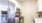 a kitchen with a refrigerator and microwave