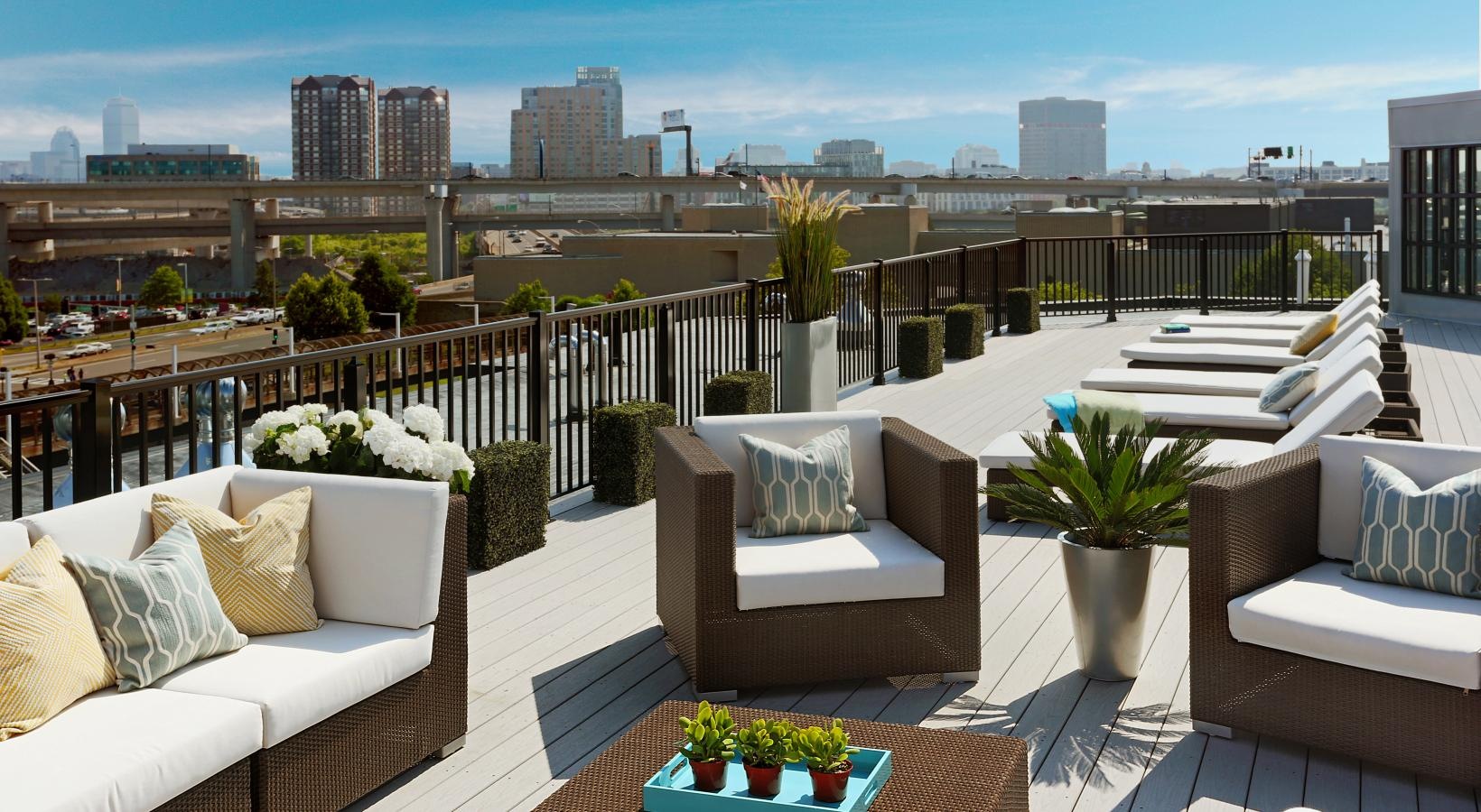 Settle into comfort at Gatehouse 75 a deck with a view of a city and the ocean