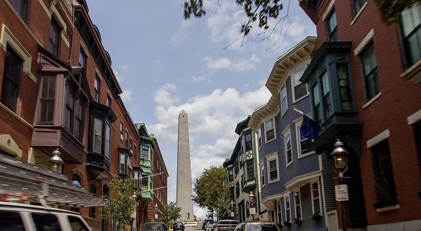 Find your perfect fit at Gatehouse 75 a street with cars and buildings on either side of it