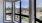 a group of windows with trees outside