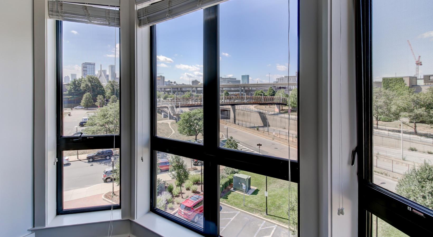 Settle into comfort at Gatehouse 75 a group of windows with trees outside