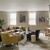 a spacious room with 2 windows