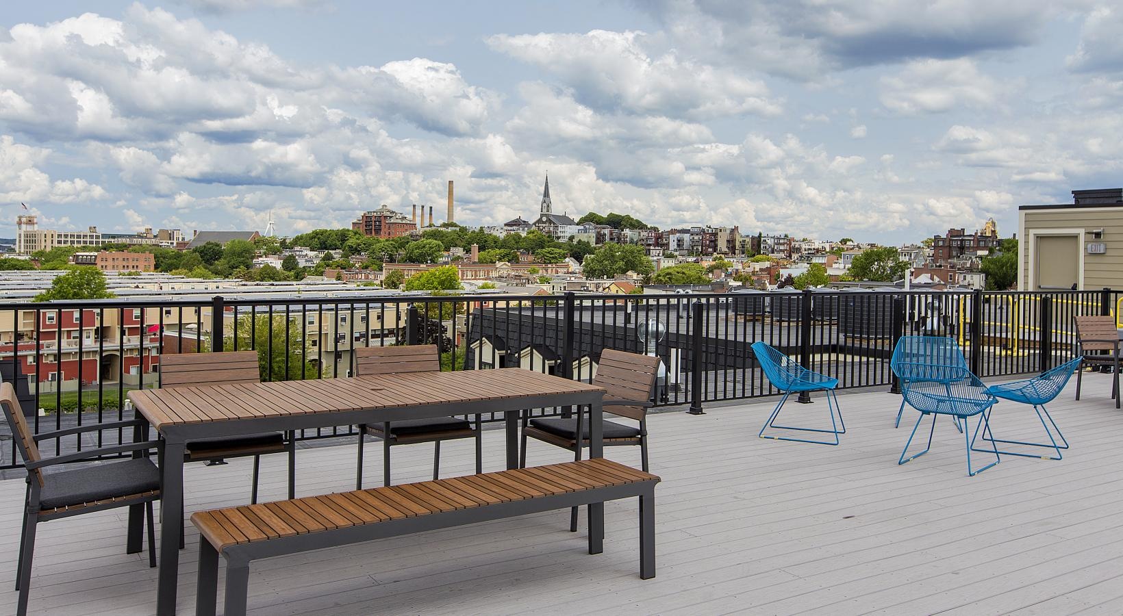 The essence of exceptional living a table and chairs on a deck
