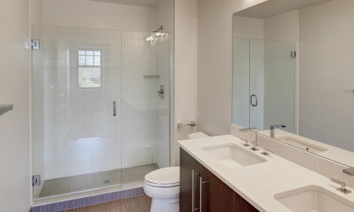 a bathroom with a shower and sink