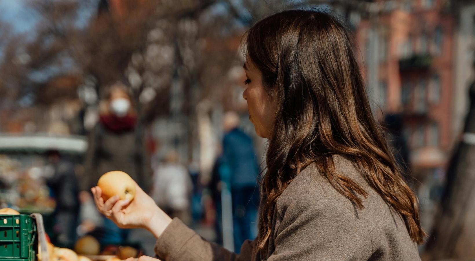 The essence of exceptional living a person holding a fruit