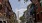 a street with cars and buildings on either side of it