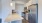 a kitchen with white cabinets