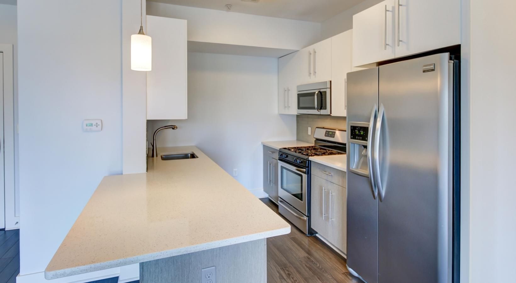 Spacious kitchens with thoughtful details a kitchen with white cabinets