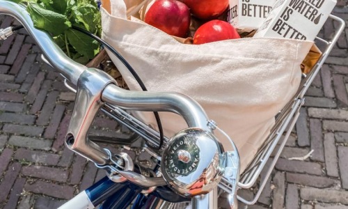 Settle into comfort at Gatehouse 75 a bicycle with a basket full of vegetables