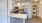 a kitchen with white cabinets
